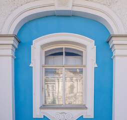 Fototapeta premium A wooden window in the wall of an old building.