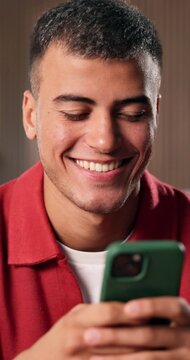 Reading, laughing and man with phone in home, funny online conversation and internet meme for texting. Message app, social media and happy person with mobile for comedy video, browsing and connection