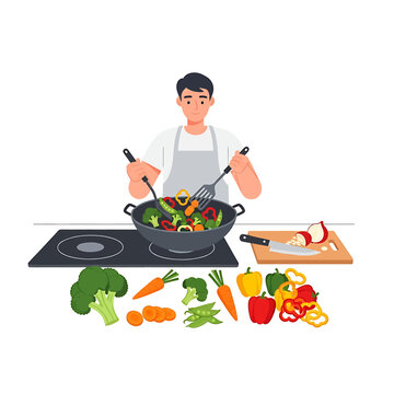 Man cooking with various colorful vegetables.