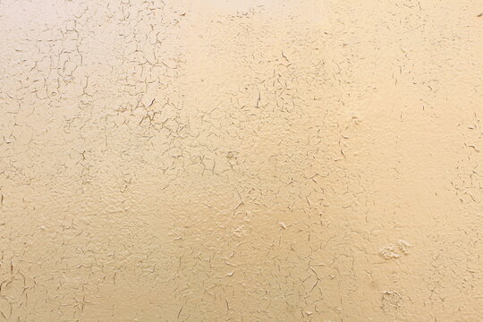 Texture of painted wall in beige color.