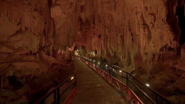 A smooth walk forwards through a cave with a stunning ceiling of flowstone.