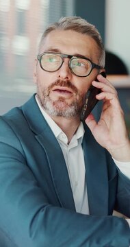 Phone call, talk and business man in office for account manager, contact or research. Trader feedback, communication and online advisor with mature employee in agency for investor chat and network