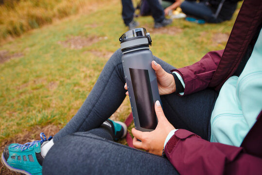 Close up of person Holding Water Bottle Outdoors