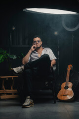Fototapeta premium Musician sitting in studio contemplating music and creativity