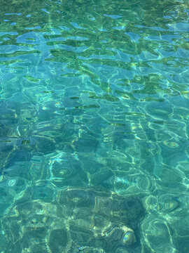Emerald sea crystal clear water vertical.
