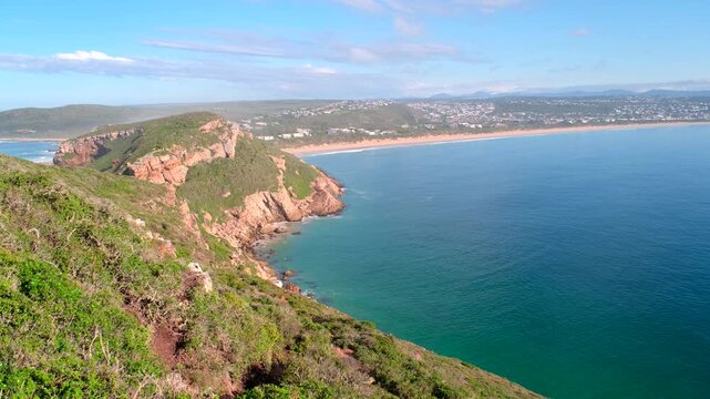 Rugged coastal sea cliffs of Robberg Nature Reserve at sunrise, Plettenberg Bay
