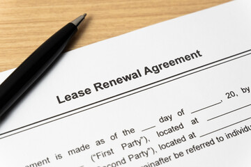 Obraz premium Legal document Lease Renewal Agreement on paper close up with pen