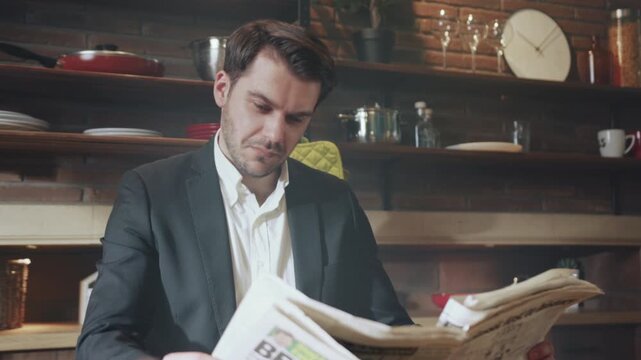 Relaxed manager enjoying newspaper, Content marketing director smiling during morning coffee in retro kitchen