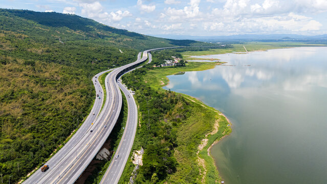 Drone shot The M6 motorway Nakhon Ratchasima Province - Bang Pa-in Lam Ta Khong River and Mountain. Motorway Korat Thailand