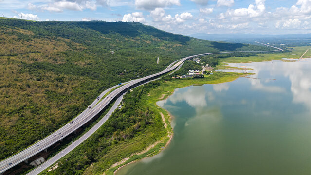 Drone shot The M6 motorway Nakhon Ratchasima Province - Bang Pa-in Lam Ta Khong River and Mountain. Motorway Korat Thailand