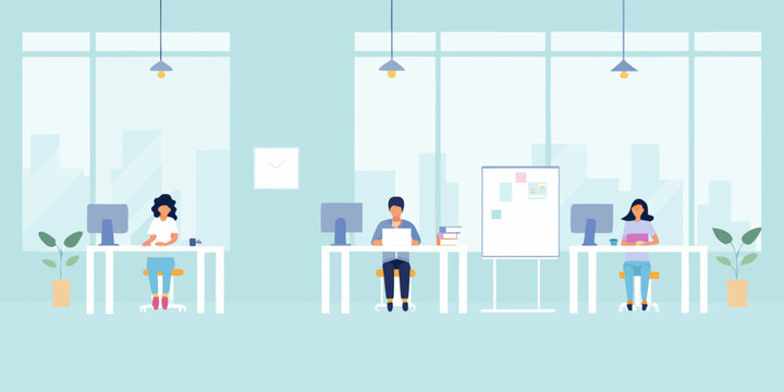 Modern office space with three people working at desks near windows