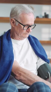 Healthcare and medicine in old age, portrait of senior man taking blood pressure at home. Use modern technology of medicine for stay healthy and controlling body condition, single aged male person