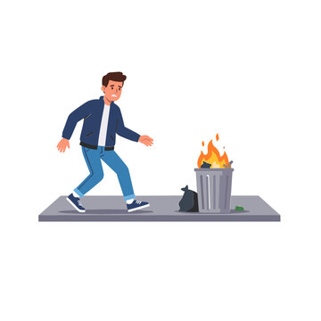 Man runs away from a burning trash can on a platform outdoors