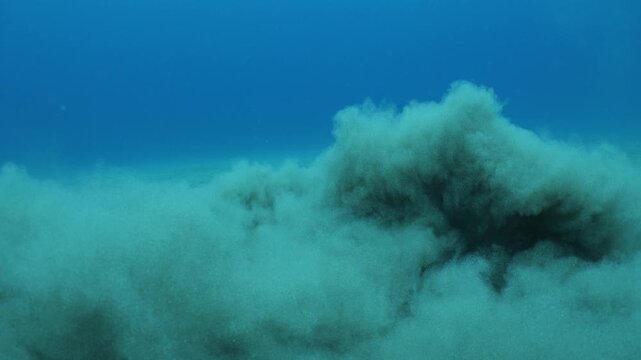 sand underwater moving making shapes  no gravity like sand storms and clouds