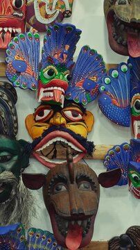 Many old colored Ceylon traditional Wooden masks Sculptures. Sri Lankan Flower Bird Devil Mal Gurulu Raksha , Fire Devil mask, Gini Raksha, Naga Raksha - Cobra demon - mask of the Raksha Kolama demon