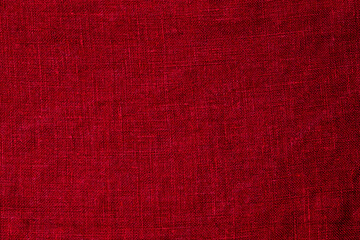 Fototapeta premium Bright red fabric showing texture and weave in a simple design suitable for various uses