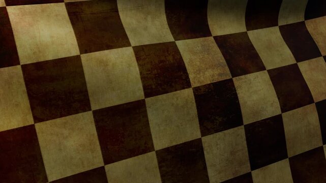 Close-up of the checkered flag with worn fabric texture fluttering in the wind