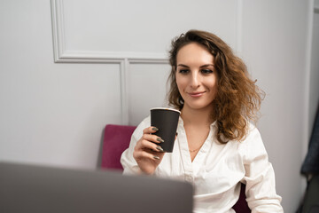 Fototapeta premium Businesswoman laptop coffee working modern cafe environment