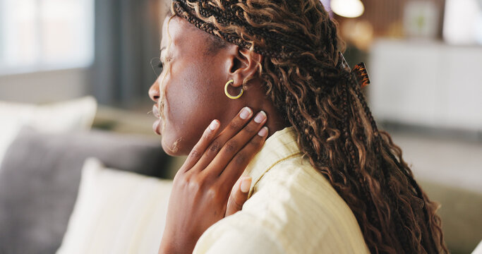 Stress, tension and woman with neck pain on sofa for muscle cramp, stiffness and pinched nerve. Discomfort, black person and joint strain in home with shoulder inflammation, poor posture and anxiety