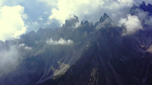 Clouds running among the solemn peaks of Cadini di Misurina in the Dolomite Alps, Italy