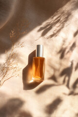 Fototapeta premium Luxury Perfume Bottle with Soft Natural Shadows on Linen Fabric Background