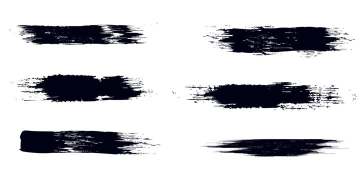 black grunge brush strokes set creating rough hand drawn texture on white background.