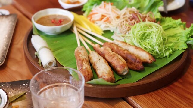 Vietnamese Grilled Pork Skewers Nem Nuong Platter with Fresh Herbs