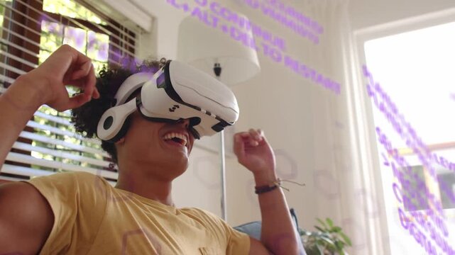 Man on couch using VR demo, purple UI appearing, laughing, raising hands, adjusting HMD, reclining