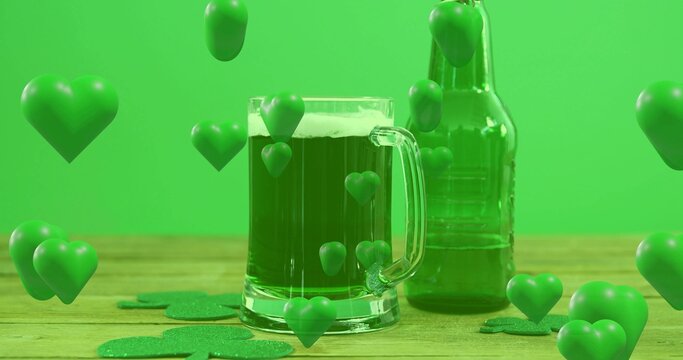 Showing clear beer mug foaming on wood table, green bottle, 3D hearts, shamrocks, green backdrop