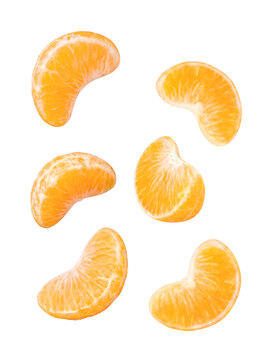 Fresh and juicy mandarin orange segments, ready to eat, scattered and isolated on transparent background.
