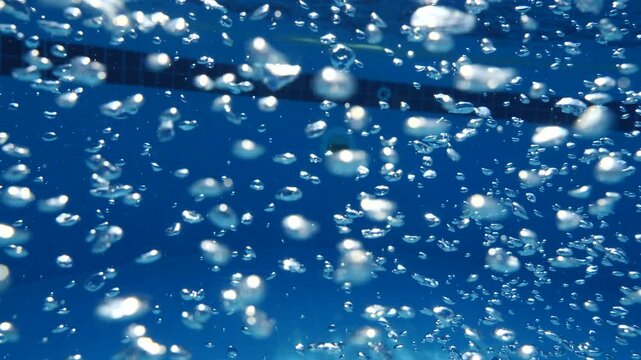 air bubbles slow  underwater coming up scenery dark blue and sun shine ocean scenery from scuba  divers backgrounds