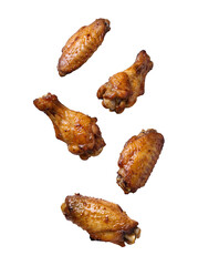 Crispy, seasoned chicken wings in a dynamic falling composition. © Caroline