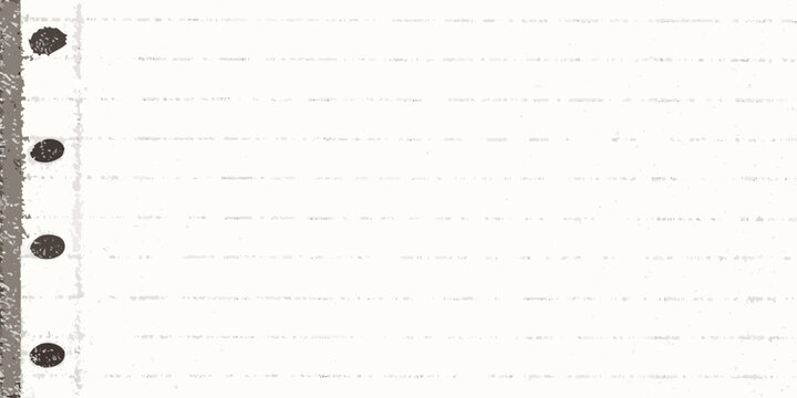 Close up of lined paper with punched holes a textured background