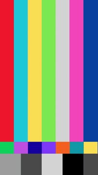 Vibrant vertical spectrum bars indicate a television signal disruption, serving as a technical display pattern for calibration