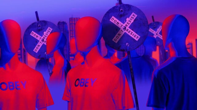 A group of faceless spinning mannequins and political statements contained on street signs on an endless loop.
