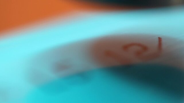 Narrow focus close-up: Thermal printer burns info onto water pipe