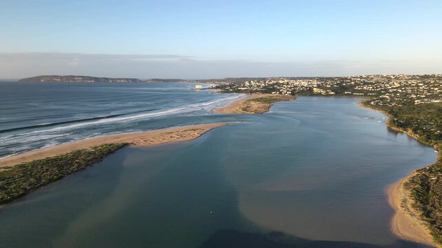 Sunrise aerial view over Keurbooms River estuary mouth and Robberg in distance