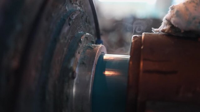 Closeup detail: Smoking hot blue water pipe manufactured in factory