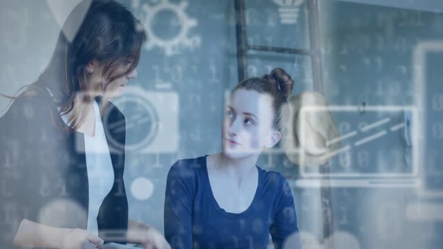 Lead showing tablet and starting tech overlay over tablet with gears mentee taking notes for review