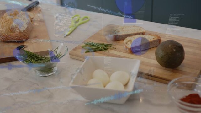 Kitchen ingredients eggs, avocado, camera shifting while blue UI overlaying objects showing prep