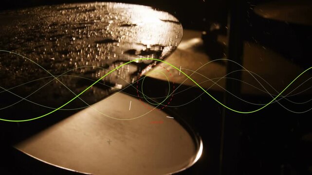 Wet cymbal taking offframe hit for sound study, vibrating and spraying droplets while sine sweeping