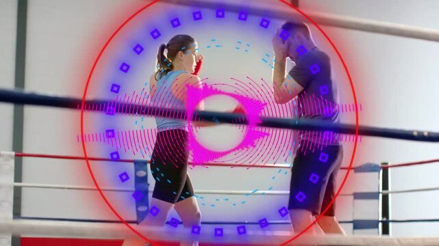 Animated circular HUD appearing and pulsing over ring, female and male boxers sparring for training