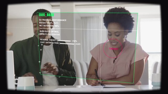 Man pointing at notes as woman writing, causing HUD overlaying torsos with red TARGET, reviewing Q4