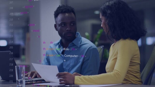 Woman pointing paper, guiding coworker reviewing security report, laptop, code overlay growing