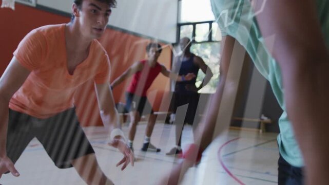 Green guard dribbling ball low, faking crossover, orange defender sliding to contest court drill