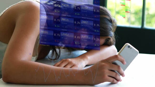 Woman lifting phone on table, causing animated market charts aligning with screen checking stocks