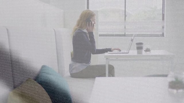 Woman tapping phone, animated call icon appearing, answering while typing laptop for office work