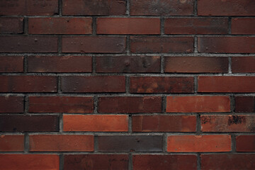 Fototapeta premium Old dark brown brick wall texture. Grunge background