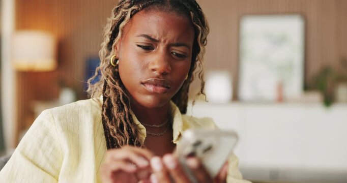 Confused, doubt and black woman with phone in home for texting, networking or communication on app. Social media, bad news and female person with tech for fake website, scam or chat in living room
