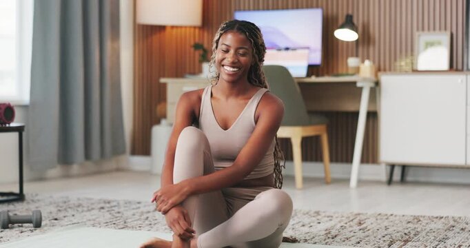 Face, funny and black woman in home, fitness for health benefits and exercise for wellness. Apartment, relax and African person in lounge, laughing and smile for commitment and workout with break